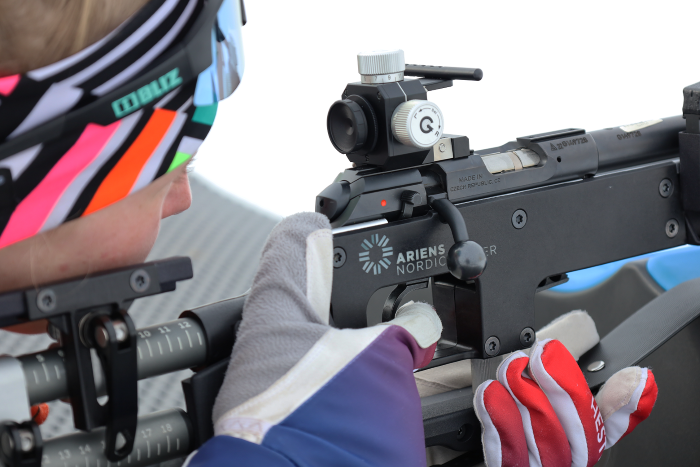 Biathlete aims rifle