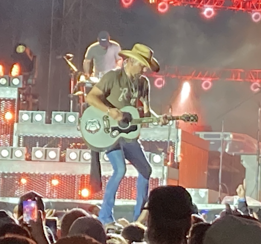 Jason Aldean on stage with guitar