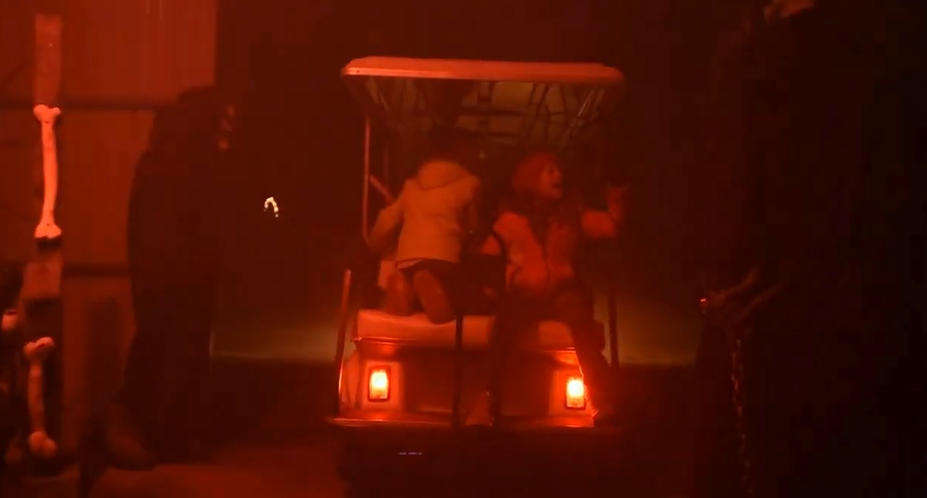 Haunted Halloween golf cart ride with 2 ghouls scaring 2 kids