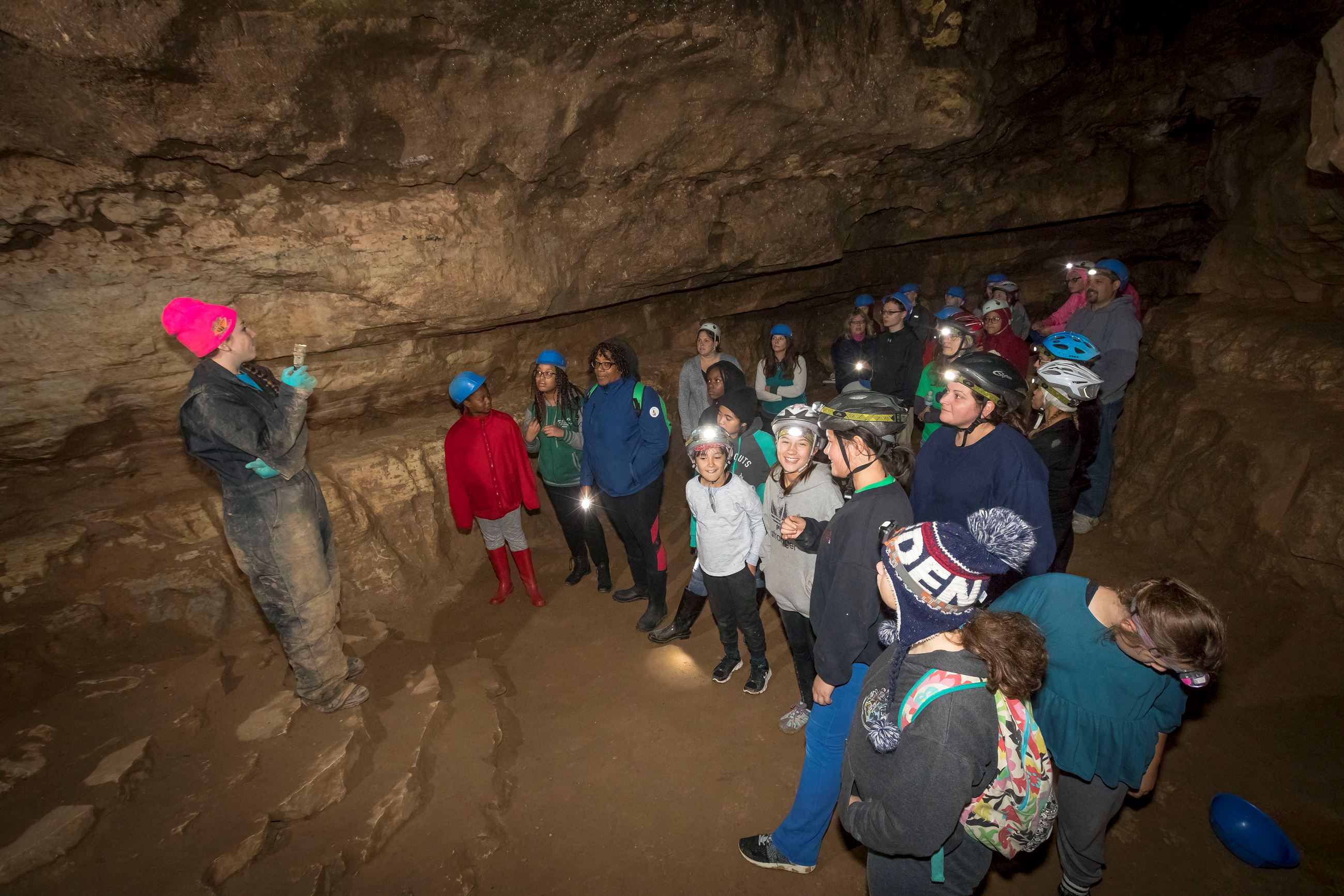 Tour guide with group of kids in cave at Ledge View Nature Center