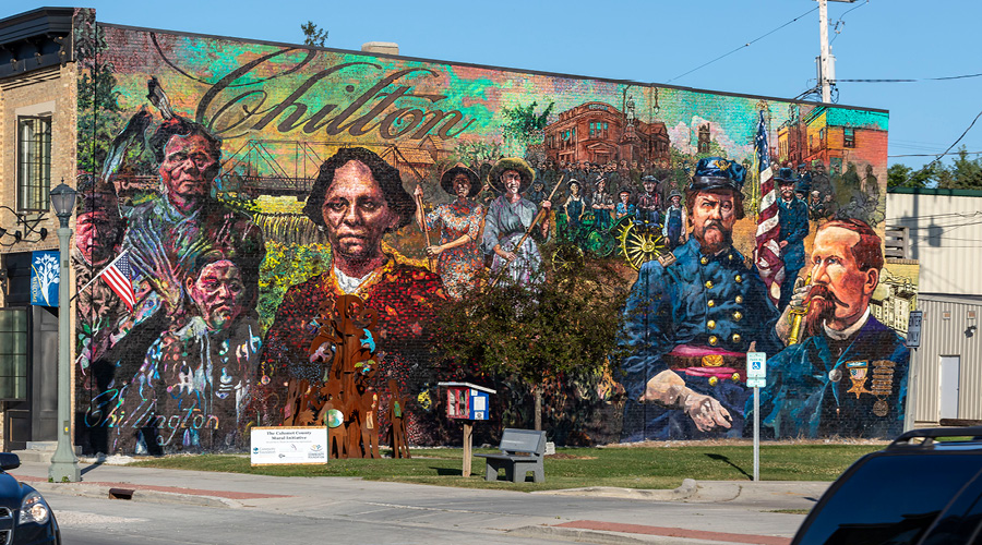 Mural of the history of Chilton on the side of a building. 