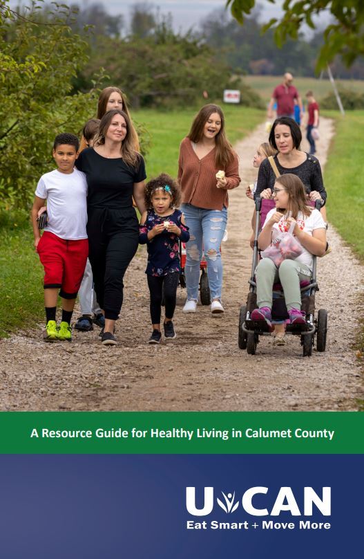 Families walking in apple orchard